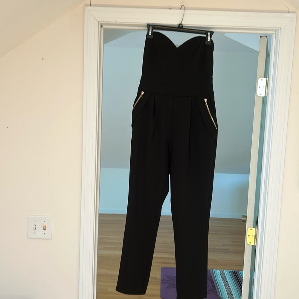 Elliatt black jumpsuit with gold zippers